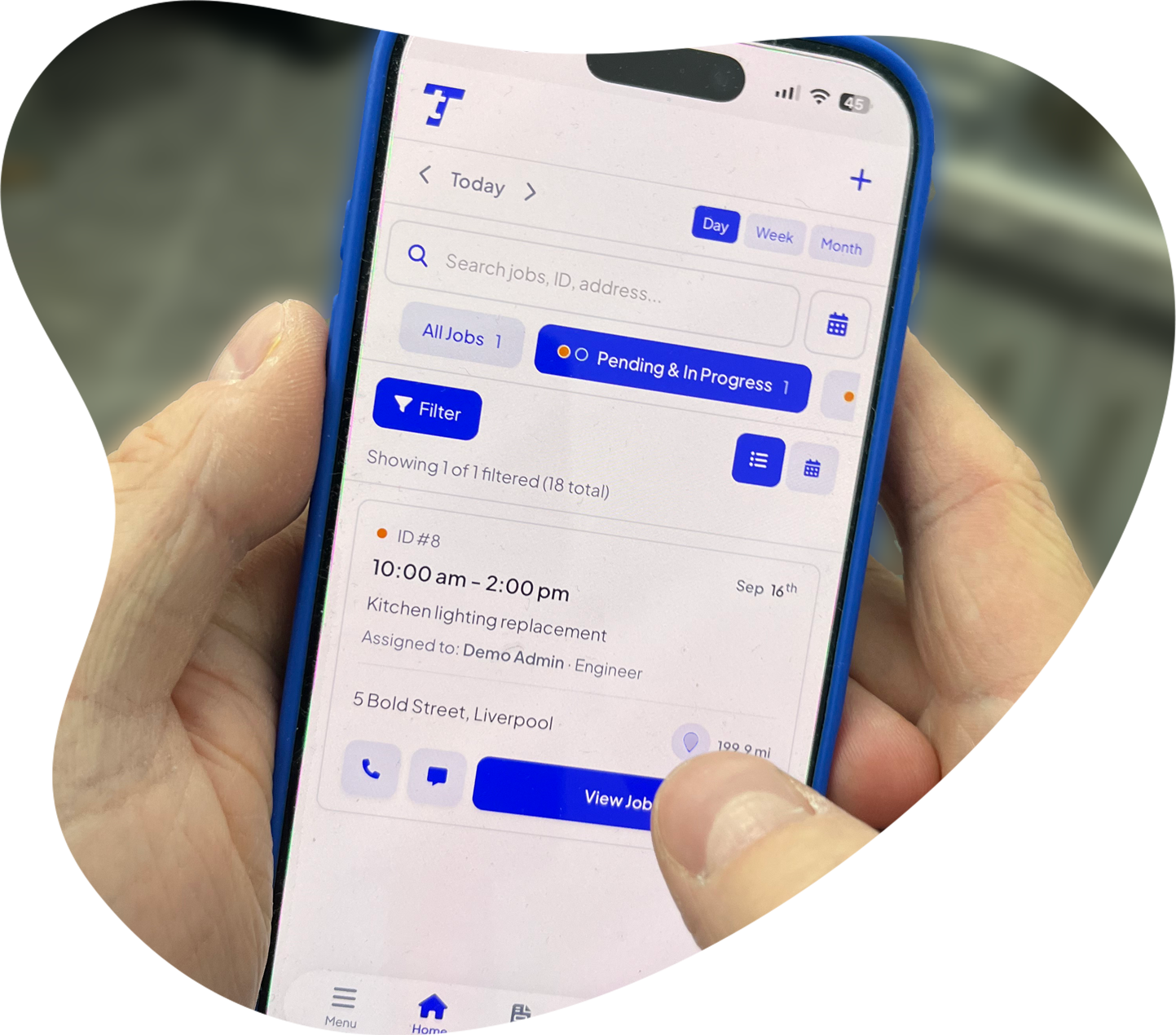 Tradesperson using Total Tradesmen on a phone