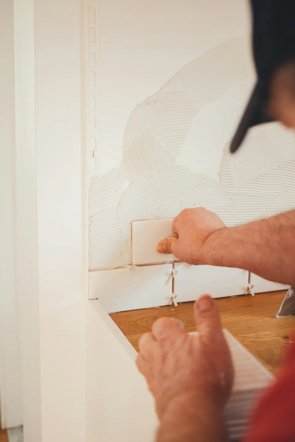 Tiler fitting tiles